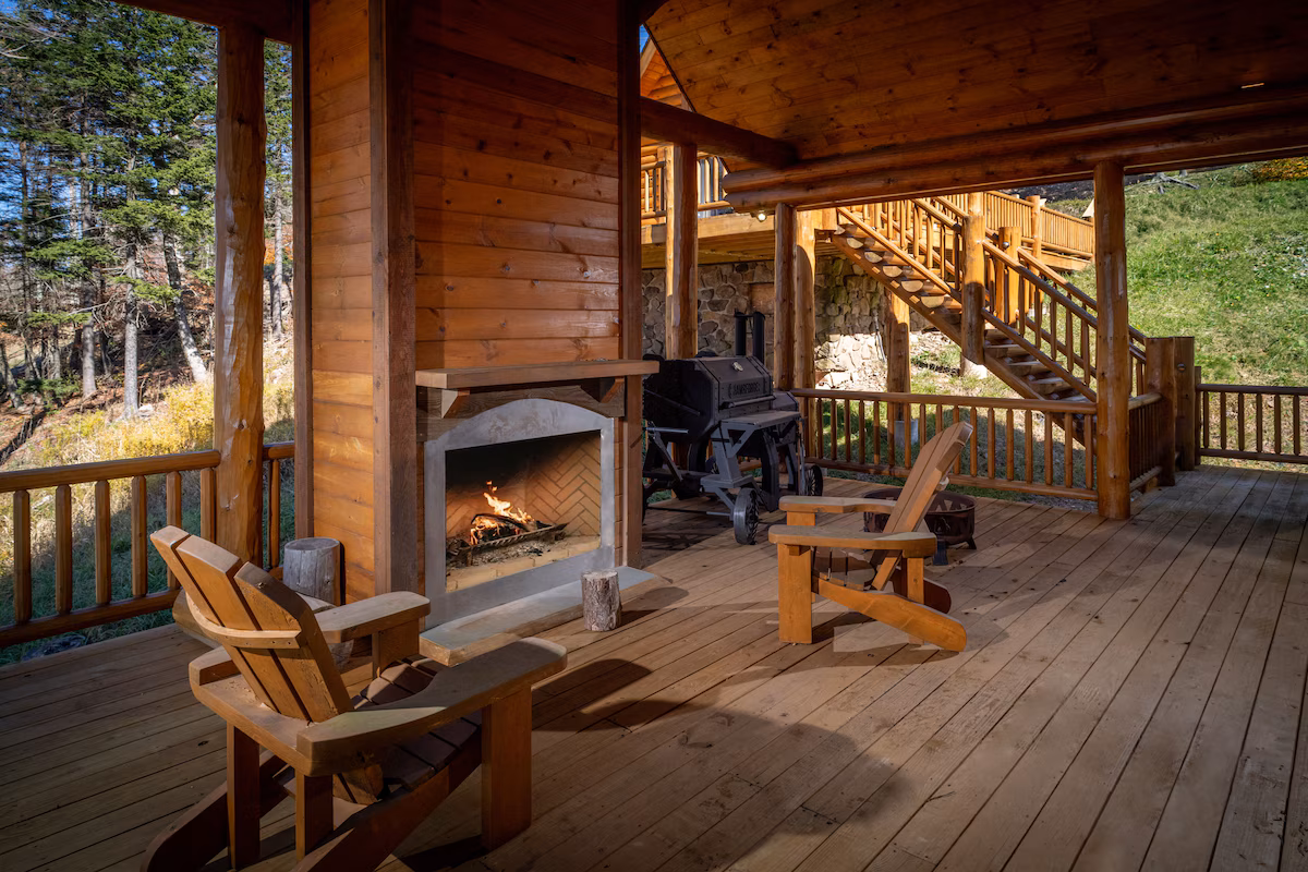 Covered outdoor sitting area with fireplace